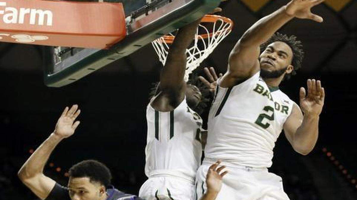 
Baylor’s Rico Gathers (2) and Taurean Prince  combine to block a shot by TCU’s Kyan Anderson in the second half. 
