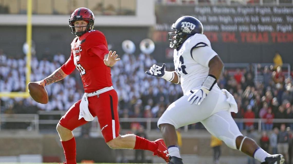 Texas Tech quarterback Nic Shimonek runs away from TCU’s Joseph Broadnax Jr. the Horned Frogs’ 27-3 win Saturday afternoon at Jones AT&T Stadium in Lubbock.