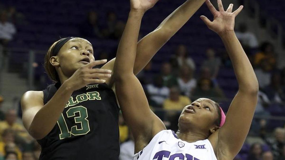 Baylor’s Nina Davis goes up for a rebound over TCU’s Jada Butts. The Bears made a major impact on the glass, outrebounding the Horned Frogs 55-30.