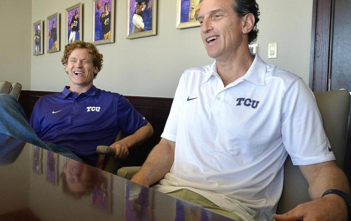 
Doug Meacham (right) and Sonny Cumbie share a light moment during a visit with media in April 2014, shortly after their hires as co-offensive coordinators.
