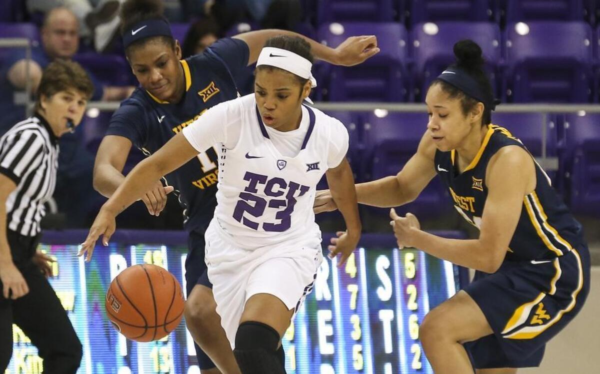 TCU guard AJ Alix, swiping the ball from West Virginia’s Anja Martin on Thursday, leads the Horned Frogs with 2.0 steals per game.