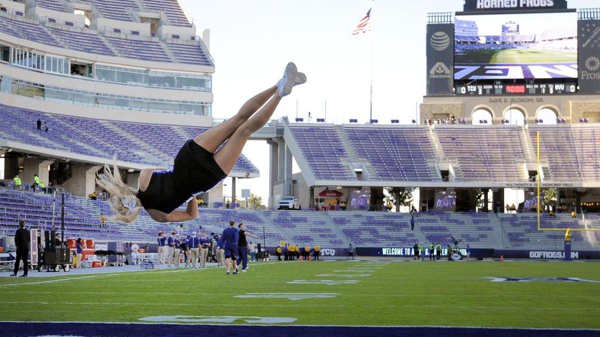 TCU Horned Frogs Cheerleader Brittany Gibson practices before the game