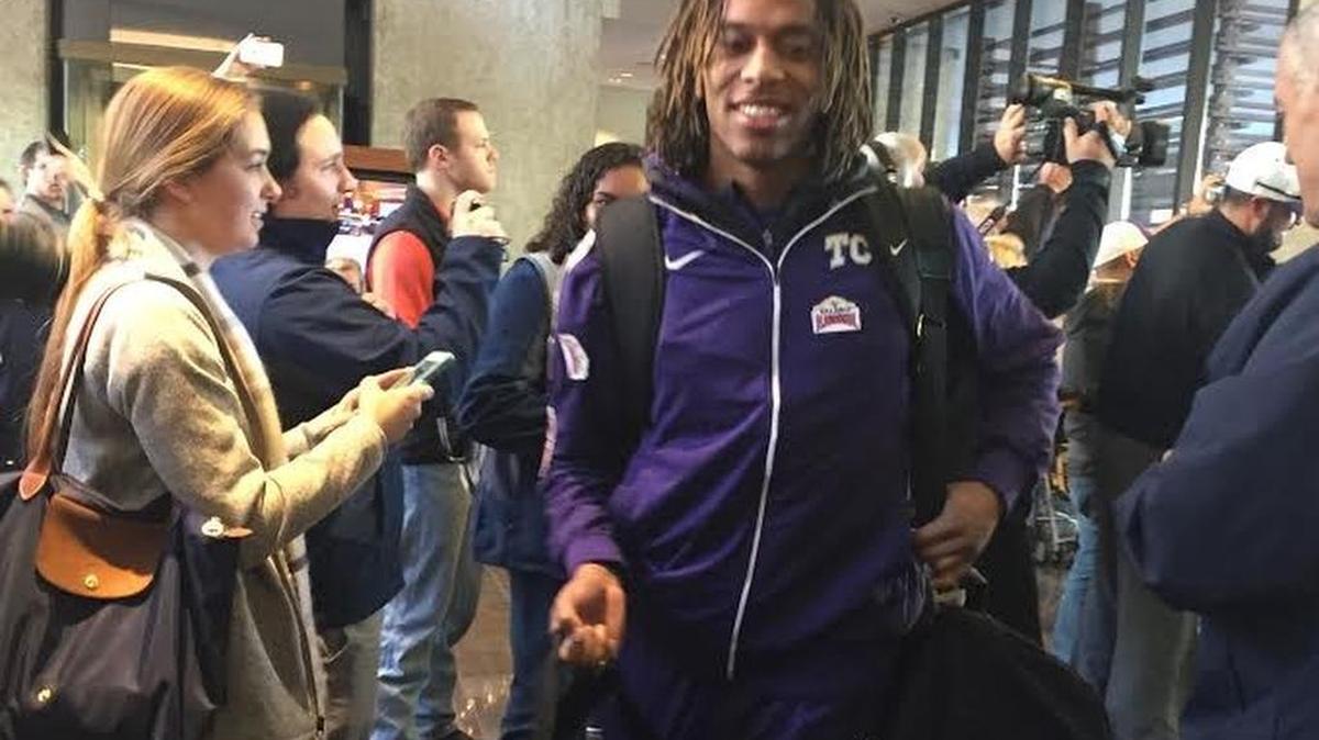 TCU receiver Kolby Listenbee smiles as he walks through the lobby of the team hotel upon the team’s arrival in San Antonio on Monday. Bowl week activities began Tuesday for the Horned Frogs and Oregon Ducks.