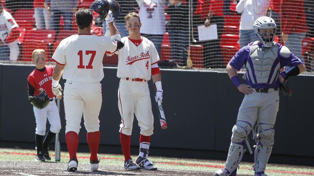 TCU catcher Evan Skoug stands arms akimbo as Texas Tech designated hitter John McMillon gets congratulations following a second-inning home run on Sunday in Lubbock. It was one of four home runs against TCU pitching in the game.