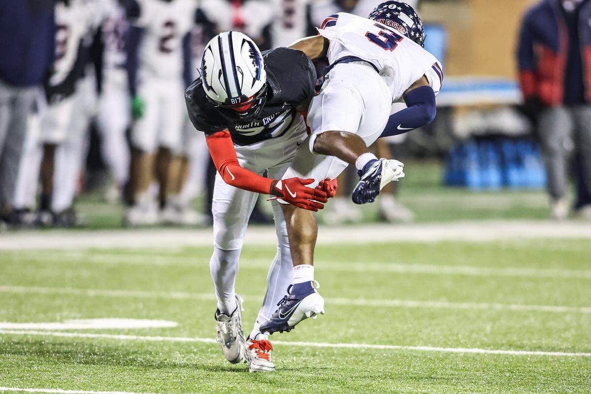 North Crowley’s Braylen Cunningham tackles Allen’s Caleb Smith (3) during the Class 6A Division I regional final Friday, Dec. 5, 2025, at DATCU Stadium in Denton.