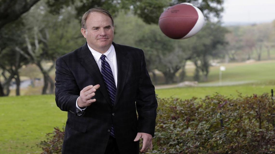 TCU coach Gary Patterson tosses a football to a cameraman during a publicity shoot for the Alamo Bowl on Dec. 10.