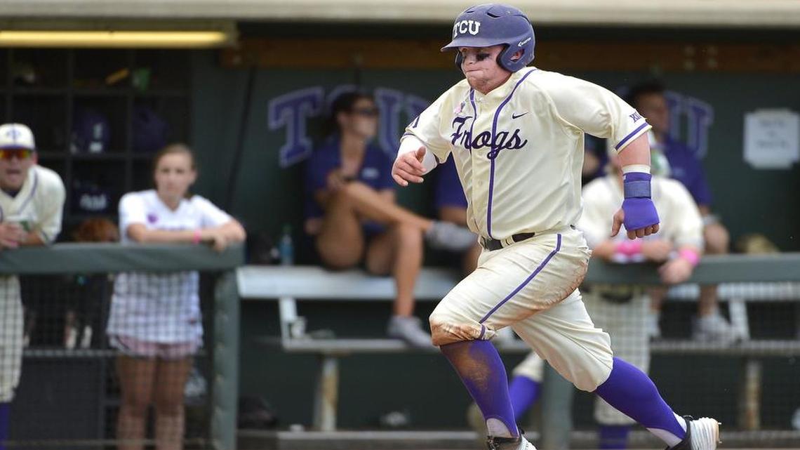 
TCU catcher Evan Skoug (9) scores on a sacrifice fly hit by TCU outfielder Nolan Brown (6) during the sixth inning as TCU beats The University of Texas 7-1 in Big 12 Baseball at Lupton Stadium in Fort Worth, TX, Sunday, April 26, 2015. TCU swept the 3 game series. 
