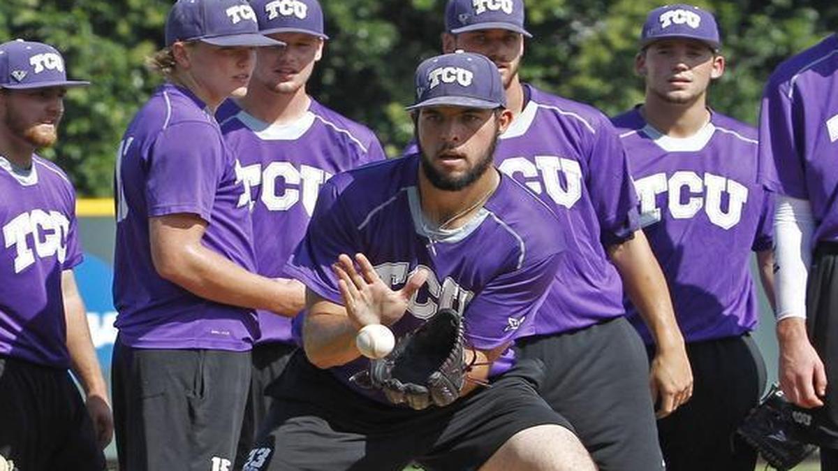 Mitchell Traver (center) fields a ball during practice at Lupton Stadium on June 14, 2016, as TCU prepared for the College World Series.
