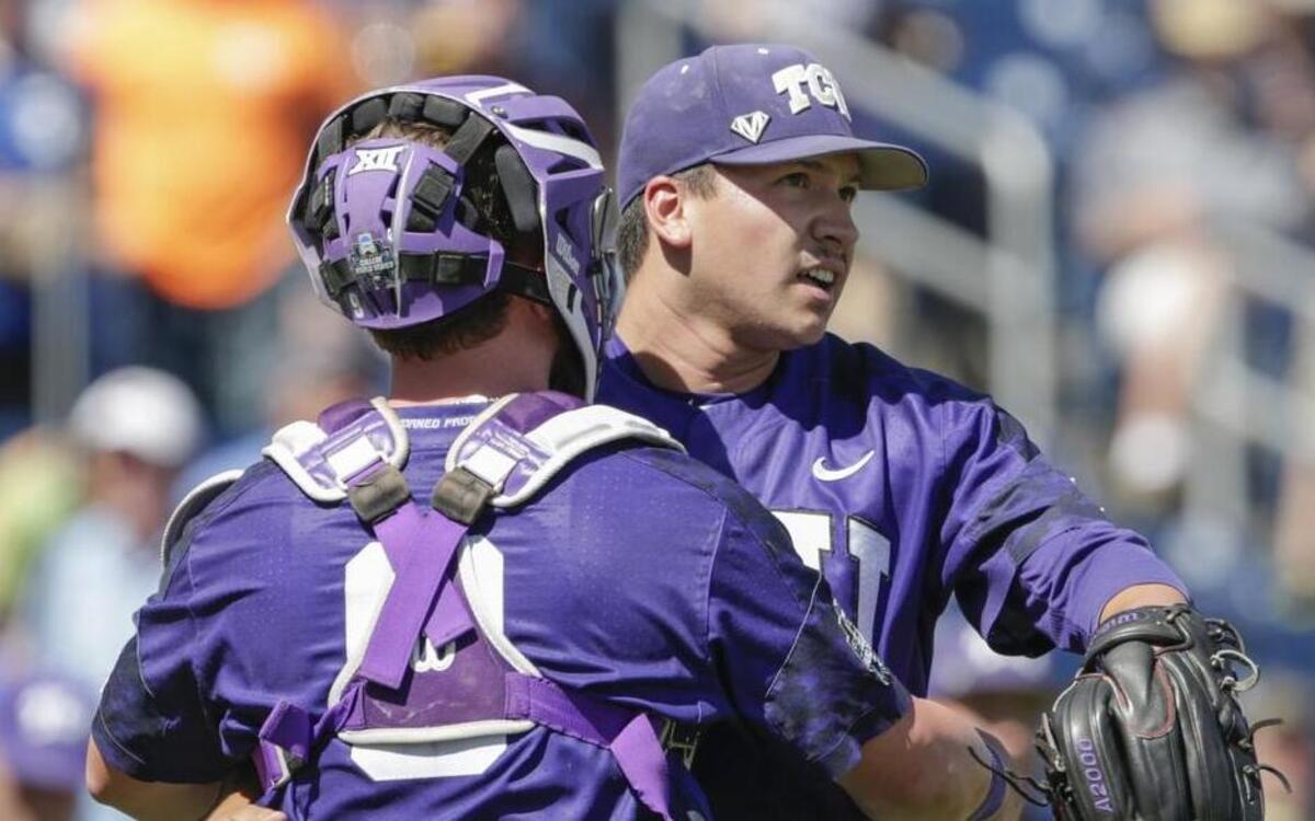 TCU pitcher Sean Wymer and catcher Evan Skoug embrace after the last out in Tuesday’s 4-1 victory against Texas A&M at the College World Series.