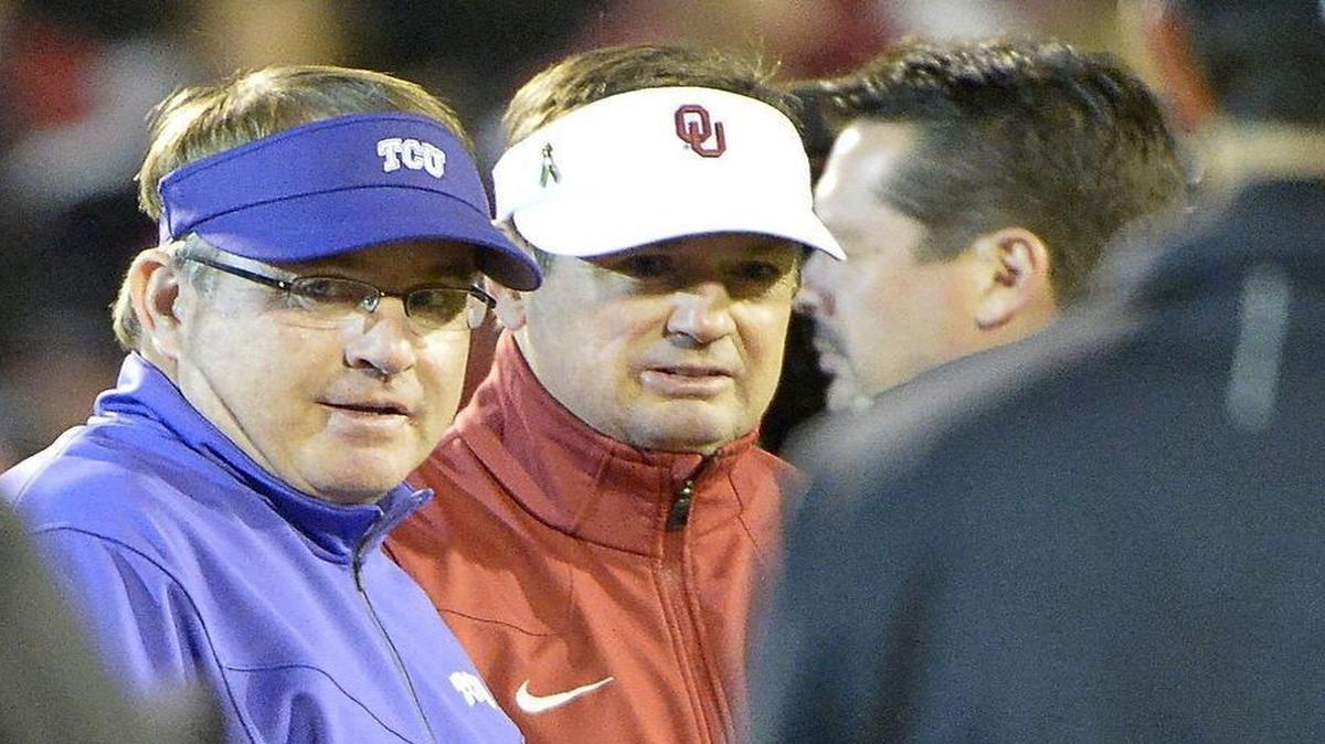TCU coach Gary Patterson visits with Oklahoma coach Bob Stoops in pregame last week. Patterson said Monday if he had to do it over again, he wouldn’t have opted for the third-quarter two-point conversion.
