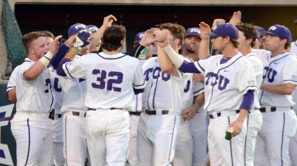 
Jeremie Fagnan (32) is congratulated by teammates after his solo home run gave TCU a 6-2 lead in the fourth inning Tuesday.

