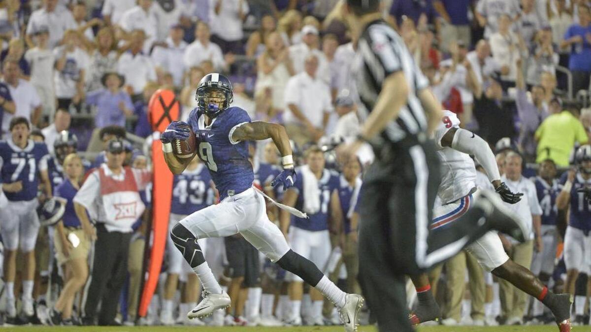 
TCU wide receiver Josh Doctson races to the end zone for a first-quarter touchdown.
