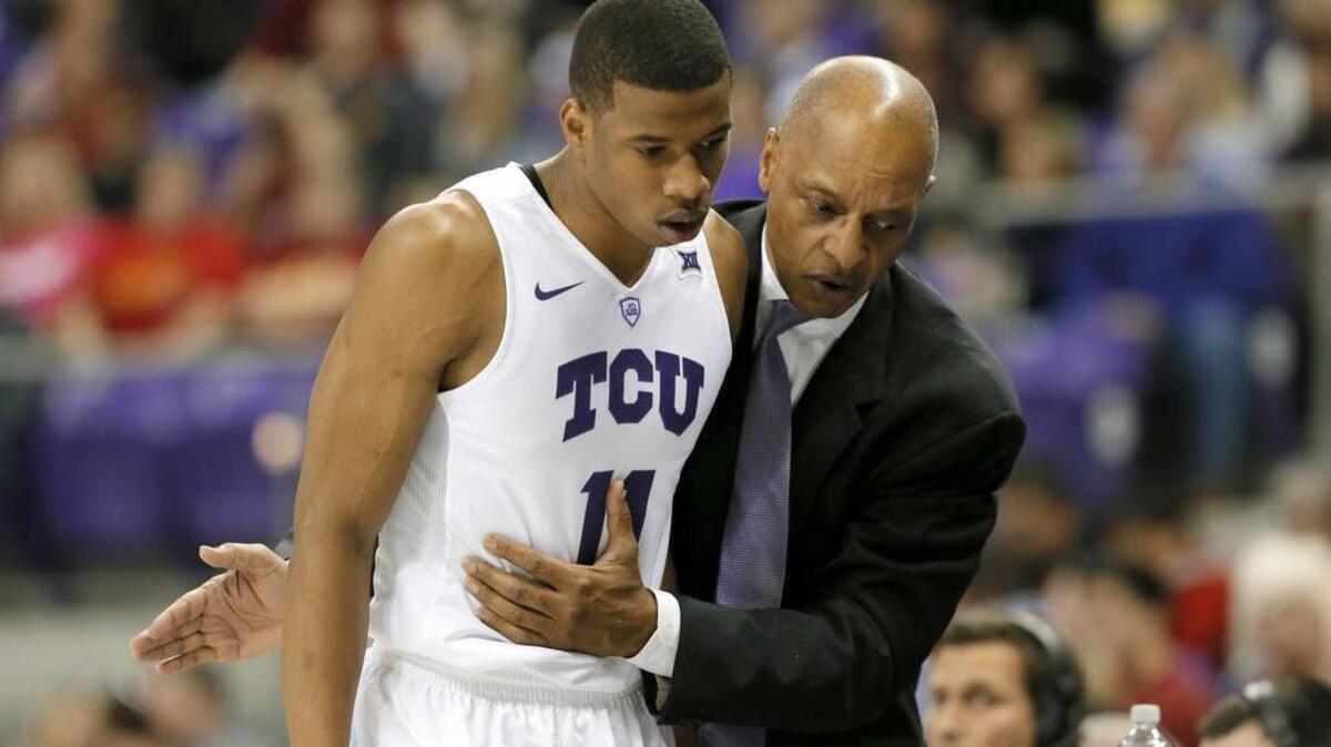 TCU guard Brandon Parrish gets instructions from coach Trent Johnson on the way to the bench in the second half of a Jan. 23 game against Iowa State in Fort Worth. Parrish went scoreless for the first time this season in the Horned Frogs’ 73-60 loss.