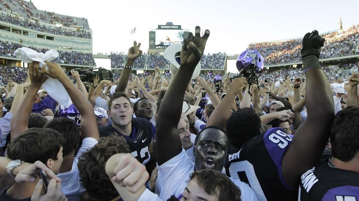 Fans and players celebrate after TCU’s upset of Oklahoma on Oct. 4, 2014, at Amon G. Carter Stadium. It was the centerpiece of a 4-0 start that season for the Horned Frogs.