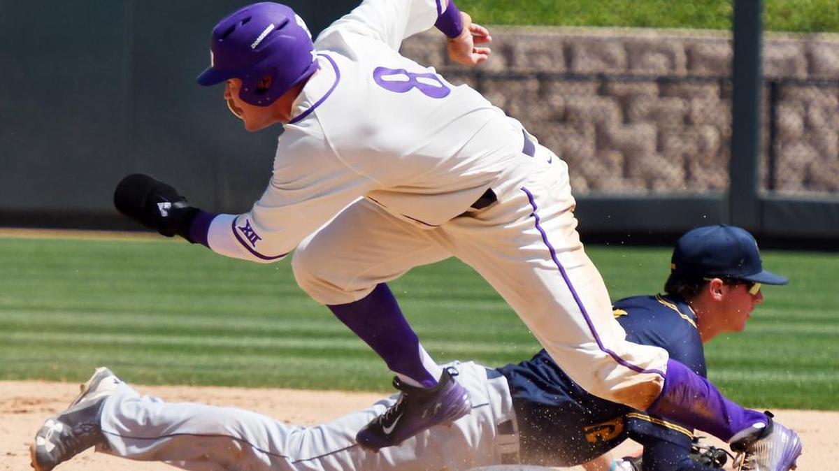 TCU baserunner Austen Wade starts for third base after the ball gets away from Murray State second baseman Caleb Hicks in the fourth inning. Wade is wearing a protective glove on his left hand, which was stepped on last weekend at Kansas State.
