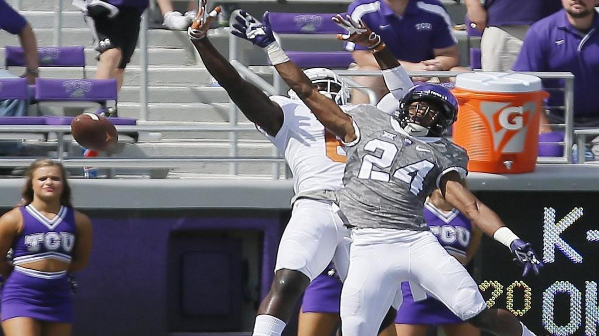 TCU freshamn cornerback Julius Lewis reaches for a pass intended for Texas tight end DeAndre McNeal in the end zone. Lewis made his first start on Saturday against West Virginia.