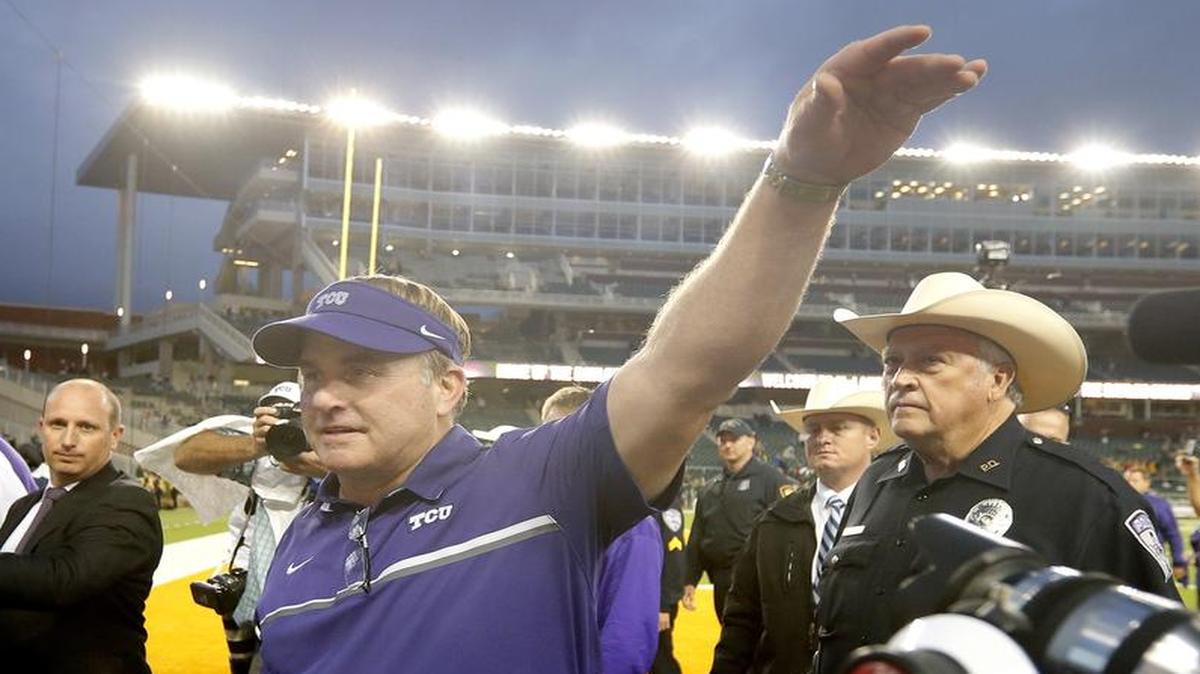 TCU football coach Gary Patterson waves to fans as he leaves the field after the Horned Frogs’ 62-22 win over Baylor on Nov. 5. The Horned Frogs have 14 recruiting commitments after landing a defensive tackle from Katy.