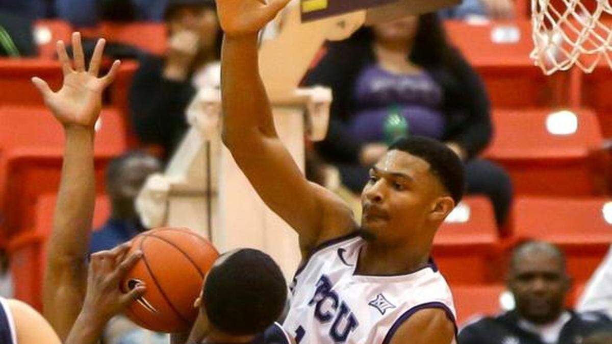 
TCU center Karviar Shepherd (14) defends Larry Lewis Jr. (34) during the first half, Saturday night, December 20, 2014, at the Wilkerson Greines Activity Center. 
