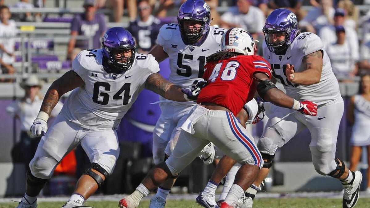 TCU linemen Matt Pryor (left), Austin Schlottman (center) and Patrick Morris close in on SMU linebacker Andrew Adams during third-quarter action of a Sept. 16 game at Amon G. Carter Stadium.