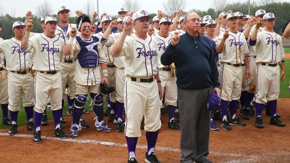 TCU coach Jim Schlossnagle and former coach Lance Brown celebrate Sunday’s milestone victory.