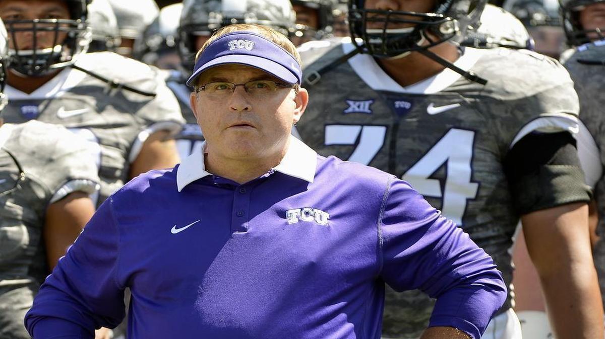 TCU coach Gary Patterson and his players wait to take the field before their game against Stephen F. Austin.