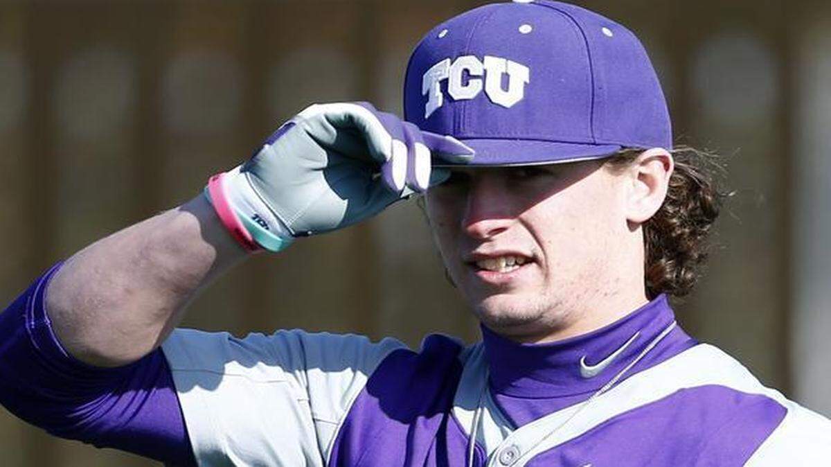 
TCU outfielder Cody Jones tips his cap to a visitor in the practice area during the team’s opening workout Friday. 
