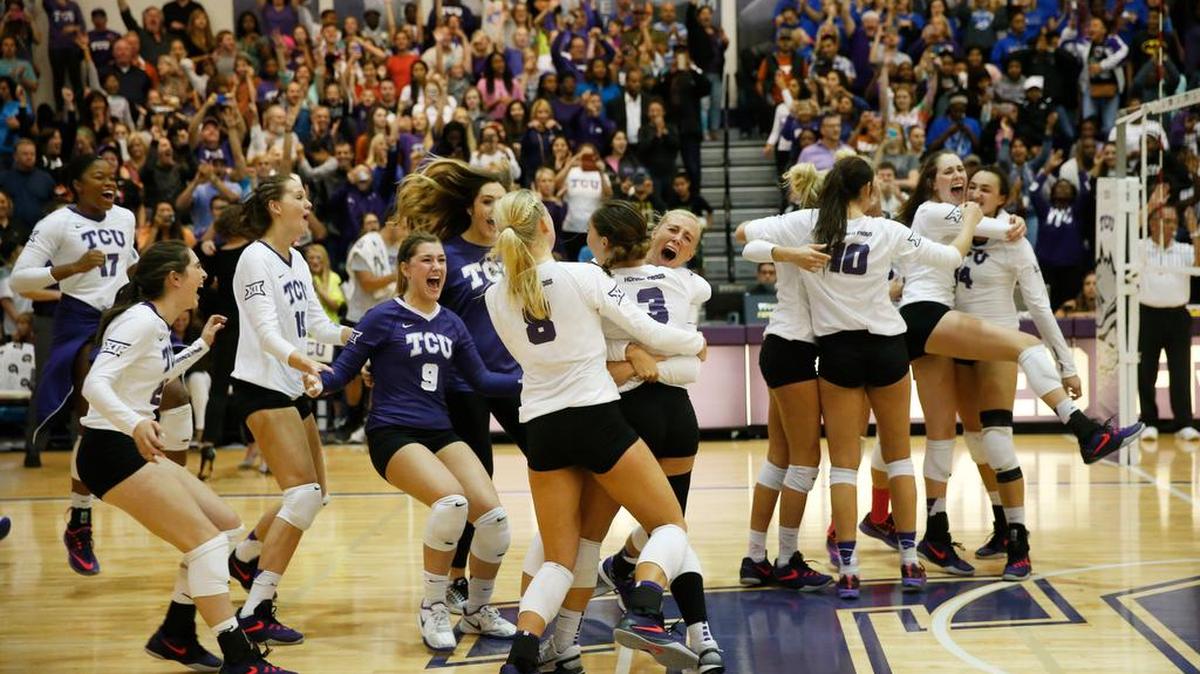 TCU volleyball players celebrate their 3-0 victory over Texas on Oct. 28. It was the school’s first victory over a top-10 team.