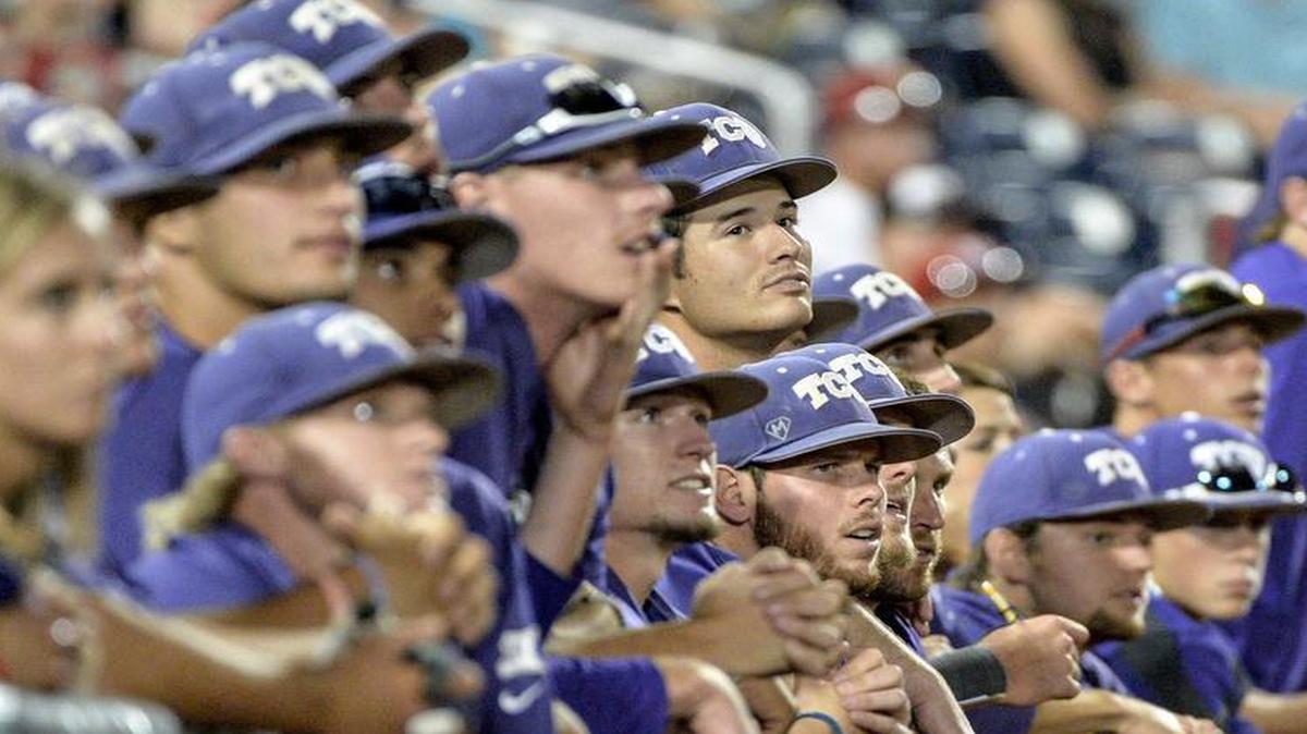 
TCU players watch from the dugout in the ninth inning of an NCAA College World Series baseball game against Vanderbilt in Omaha, Neb., Friday, June 19, 2015. Vanderbilt defeated TCU 7-1 and advances to the championship series.

