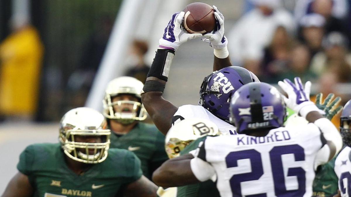 TCU linebacker Marcus Mallett intercepts a pass in the fourth quarter in a 2014 game at Baylor. The play and touchdown return gave TCU a 58-37 lead before Baylor came back for a 61-58 win. The Big 12 announced a 2:30 p.m. kickoff for this year’s meeting between the teams in Waco.