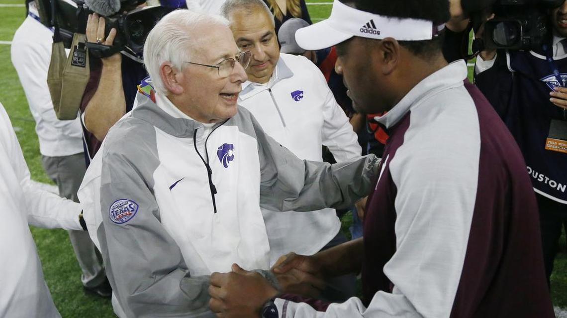 Texas A&M coach Kevin Sumlin congratulates Kansas State’s Bill Snyder after the Wildcats’ 33-28 win in the Texas Bowl. The loss by the Aggies (8-5) means college football teams from the Lone Star State probably will be shut out of the Associated Press’ postseason rankings for the first time in 49 years.