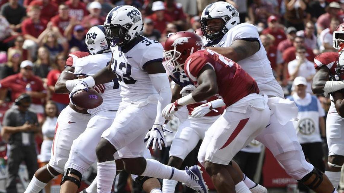 TCU running back Sewo Olonilua steps in the end zone to finish a 1-yard scoring run against Arkansas. It was one of two touchdowns for him out of the wildcat formation Saturday at Reynolds Razorback Stadium in Fayetteville.