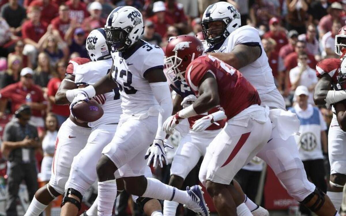 TCU running back Sewo Olonilua steps in the end zone to finish a 1-yard scoring run against Arkansas. It was one of two touchdowns for him out of the wildcat formation Saturday at Reynolds Razorback Stadium in Fayetteville.