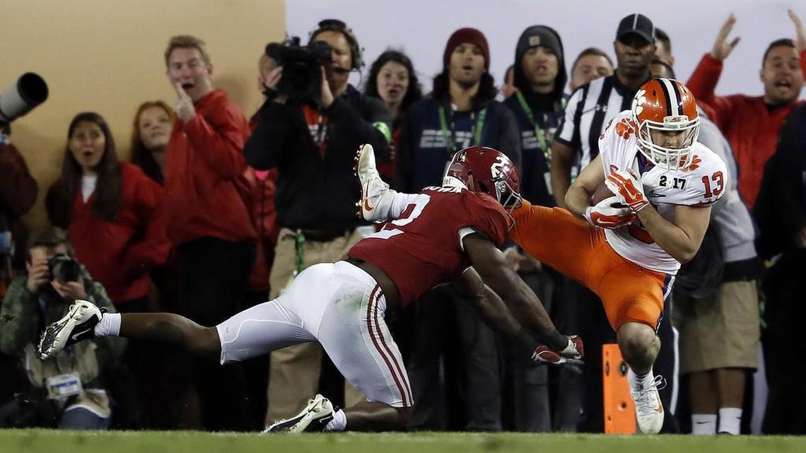 Clemson and Alabama will once again meet in the College Football Playoff, this time in a semifinal at the Sugar Bowl. (AP Photo/John Bazemore)