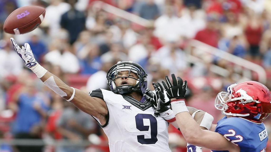 
TCU receiver Josh Doctson, left, in action against SMU last season, suffered a broken hand during spring training and is not yet practicing at full speed.


