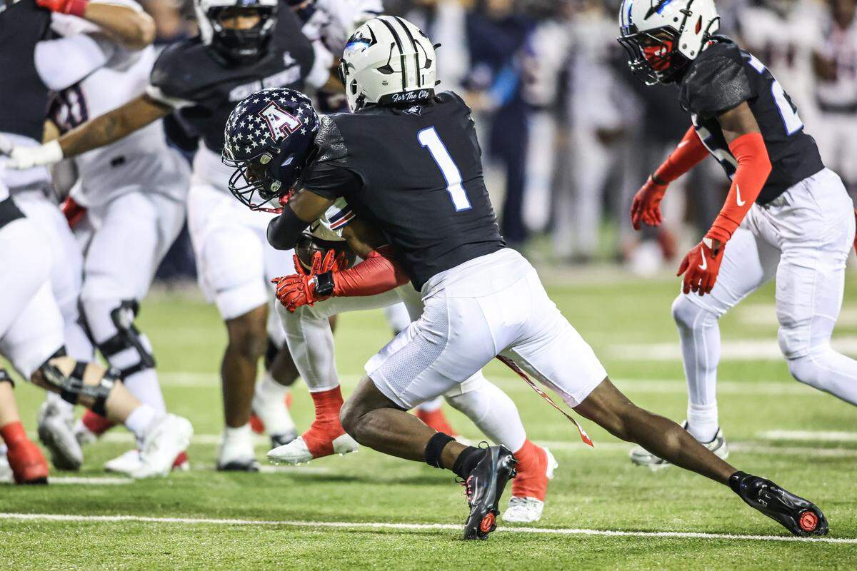 North Crowley’s Aaron Bradshaw makes a tackle against Allen during the Class 6A Division I regional final Friday.
