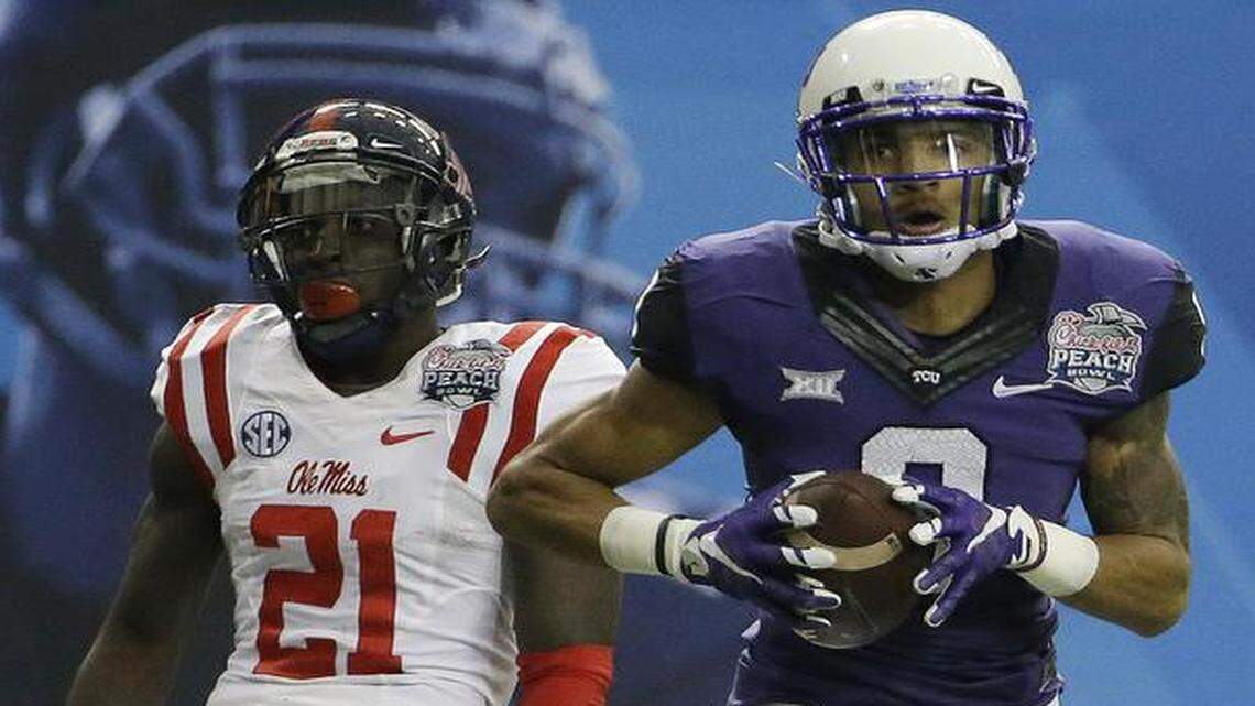 
TCU wide receiver Josh Doctson scores one of his two touchdowns against Mississippi defensive back Senquez Golson. Doctson became TCU’s record-holder for touchdown catches in a season (11) and receiving yards in a season (1,018).
