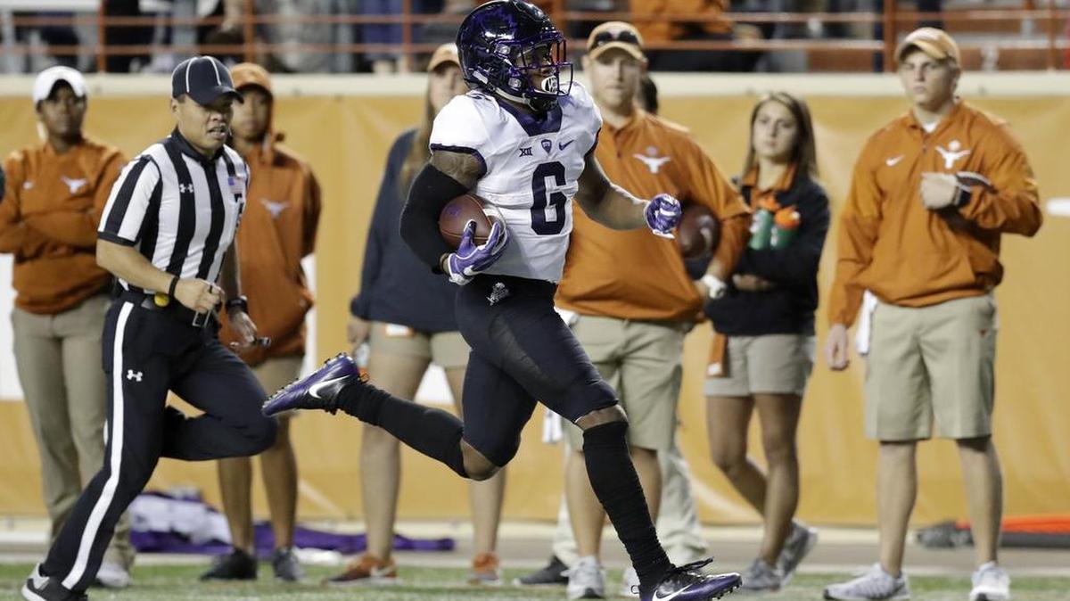 TCU running back Darius Anderson races down the sideline on a 70-yard touchdown run against Texas at Royal-Memorial Stadium in Austin. He finished with 103 yards on three carries in the Horned Frogs’ 31-9 victory Friday.