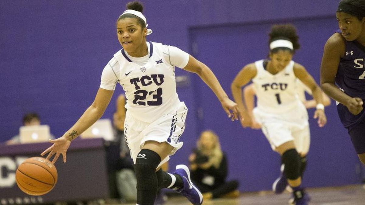 TCU’s AJ Alix, left, sprints up the court after a steal during TCU’s 88-55 victory over Stephen F. Austin.