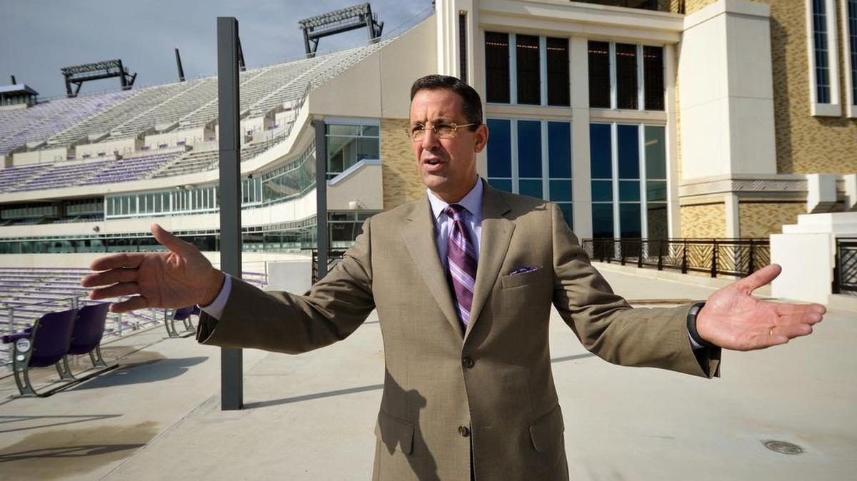 Chris Del Conte stands in the north end zone to speak to reporters about the renovations to Amon G. Carter Stadium on Aug. 27, 2012.