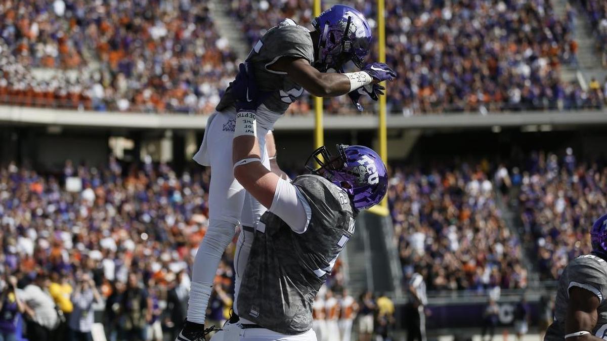 
Freshman KaVontae Turpin, left, gave TCU a big lift with 138 receiving yards and four touchdowns, much to the delight of teammate Bobby Thompson.


