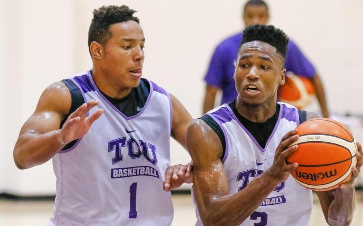 TCU guard RJ Nembhard (right) works against the defense of Desmond Bane during practice July 19 in Fort Worth.