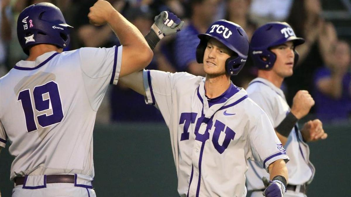 TCU’s Cam Warner (right) exchanges congratulations with teammate Luken Baker after a two-run home run in the eighth inning against Arizona State on June 5 in the Fort Worth Regional. The hit helped TCU secure an 8-1 victory for a berth in a Super Regional series at Texas A&M.
