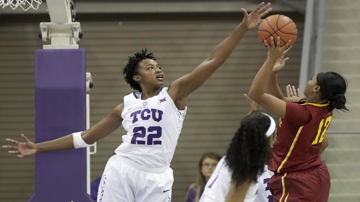 TCU Horned Frogs sophomore center Jordan Moore blocks a shot by Iowa State Cyclones high-scoring guard Seanna Johnson in their first meeting, an 80-75 TCU victory on Jan. 15. The teams meet again at noon Saturday in Ames, Iowa.