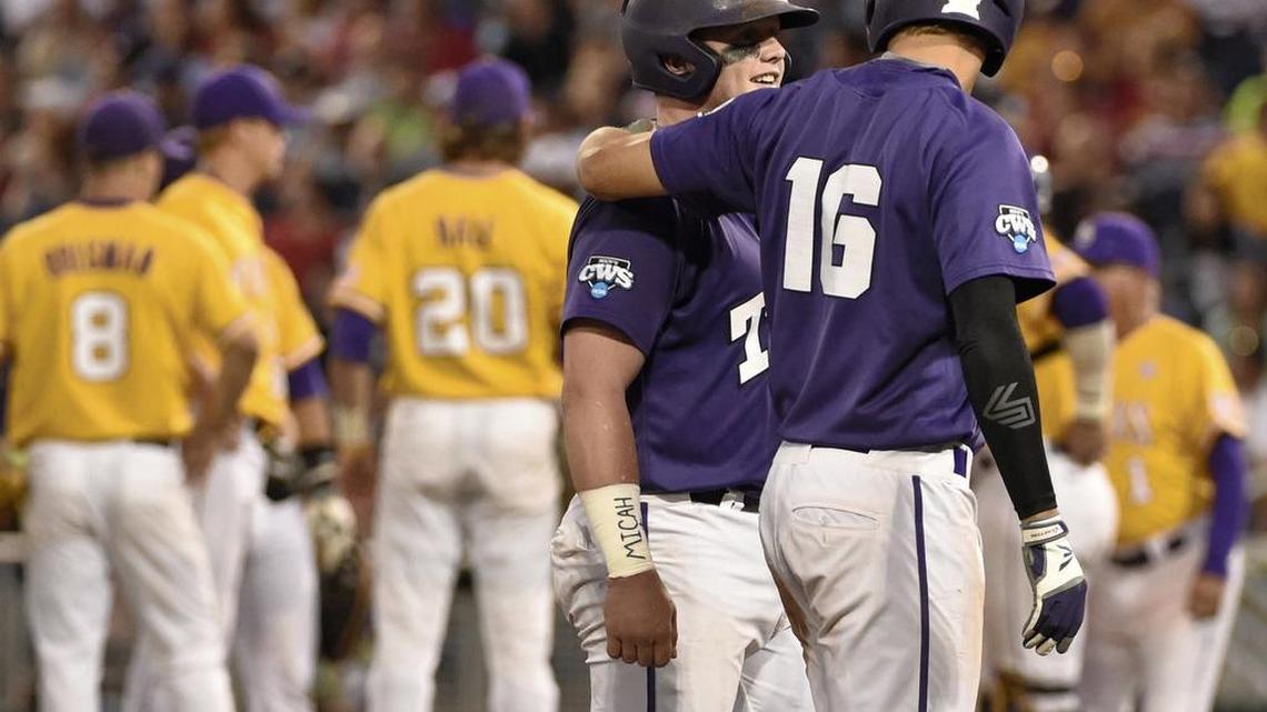 TCU’s Evan Skoug (left) gets a greeting from Connor Wanhanen after they scored on a two-run single by Dane Steinhagen in a College World Series game against LSU on June 18, 2015. All three players return for the Horned Frogs in 2016.