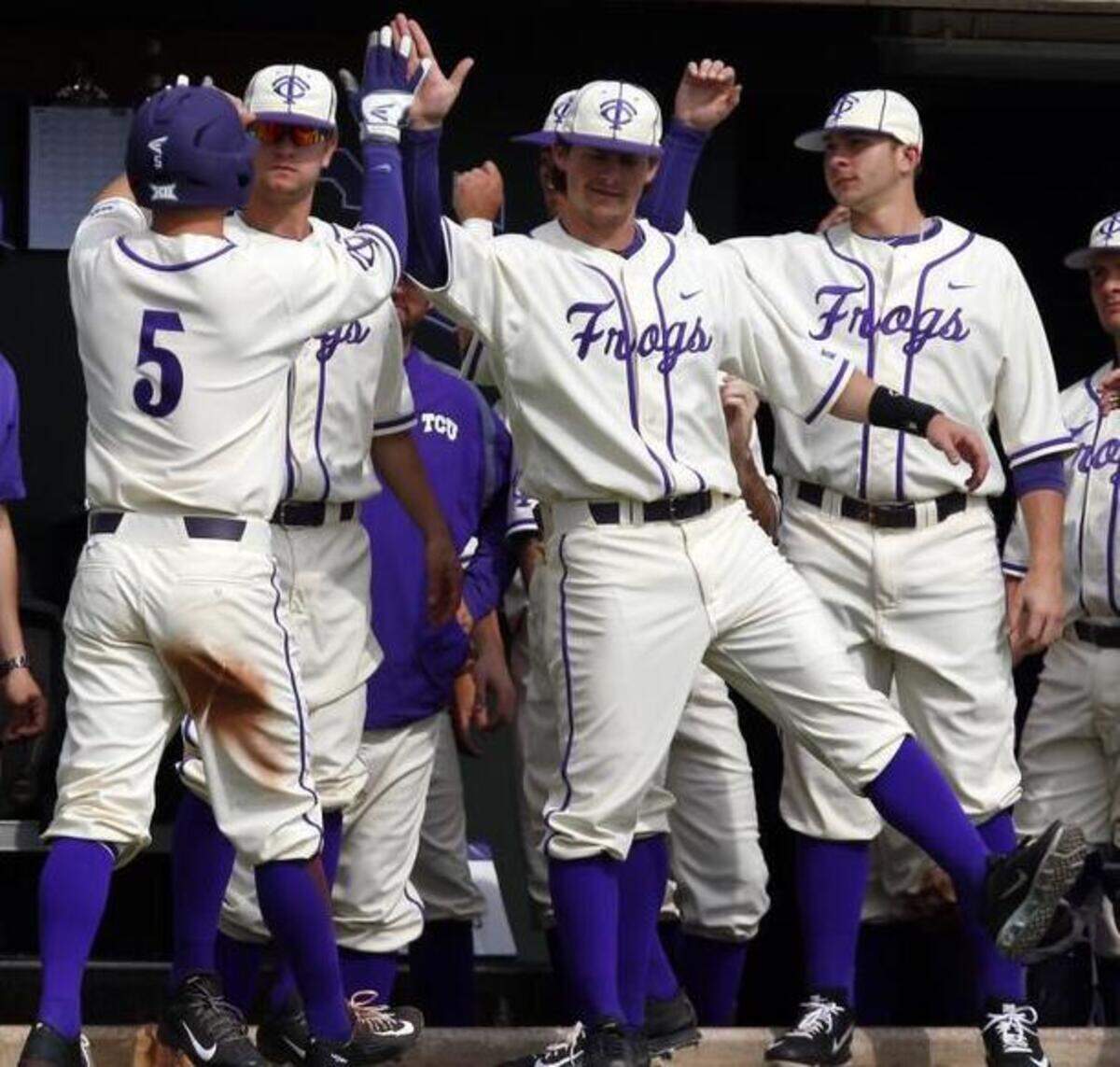 
TCU’s Derek Odell (5) is greeted by teammates after scoring against Southern Illinois on Sunday. 
