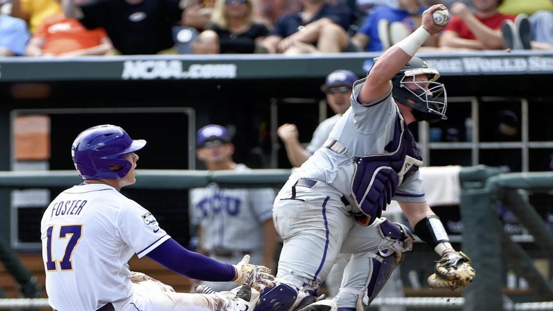 
TCU catcher Evan Skoug holds up the ball after tagging out LSU second baseman Jared Foster, who was thrown out at home by Horned Frogs center fielder Cody Jones.

