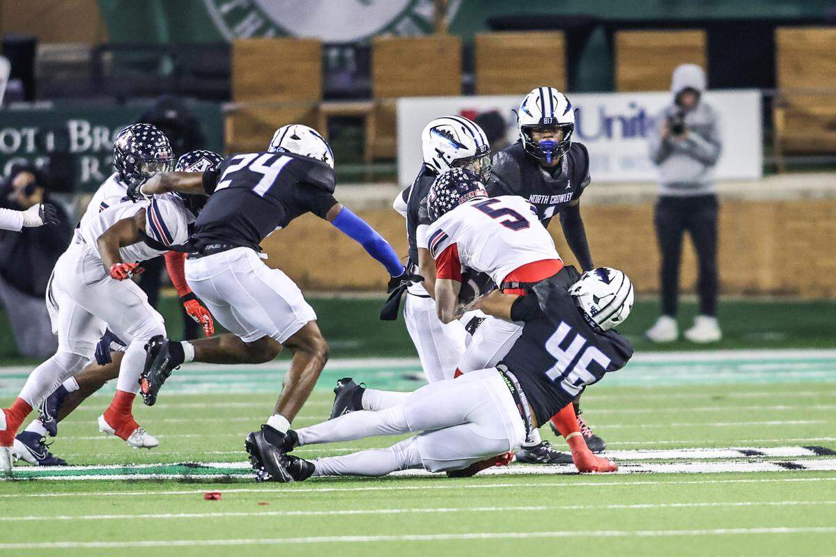North Crowley’s Jordan Herigon (46) tackles Allen quarterback Jeremiah Daoud (5) during the Class 6A Division I regional final Friday.