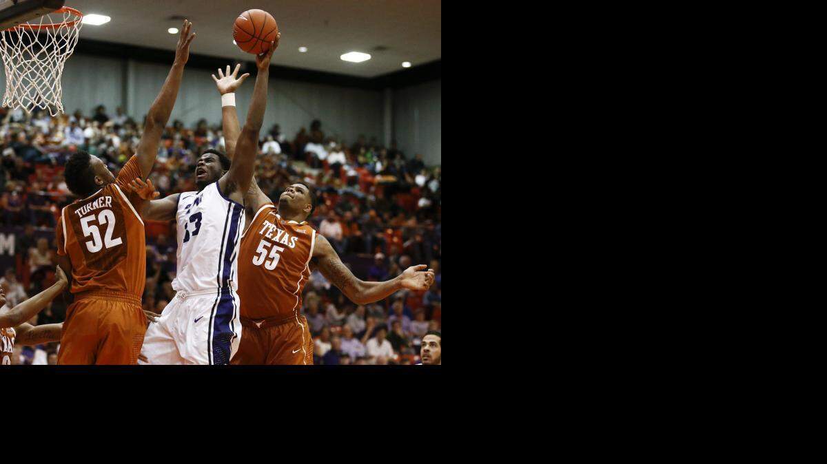 
TCU and Chris Washburn, center, against Texas earlier this season, have shot less than 40 percent in five of their 10 Big 12 games.


