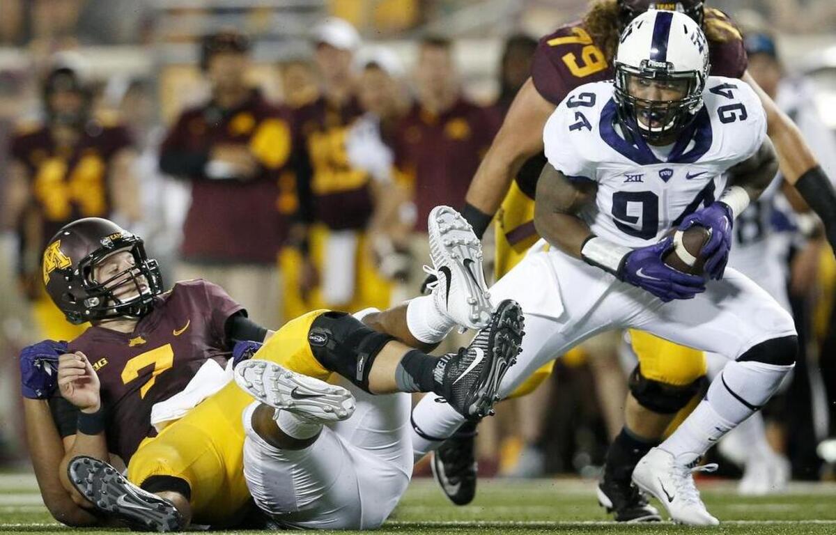 
TCU’s Josh Carraway recovers a fumble by Minnesota’s Mitch Leidner last week.
