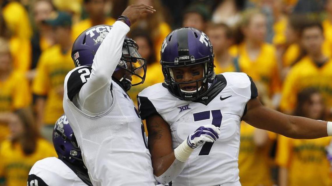 TCU Horned Frogs quarterback Trevone Boykin (2) and wide receiver Kolby Listenbee (7) celebrate a first-quarter touchdown against the Baylor Bears in 2014. Listenbee is suing TCU and the Big 12, alleging abuse and harassment.
